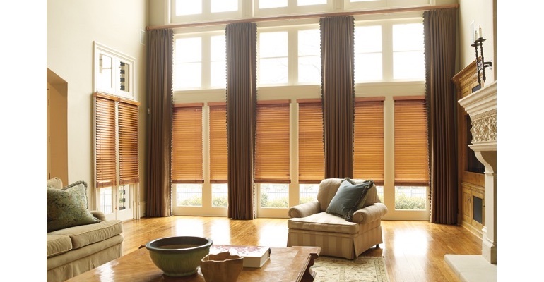Honolulu great room with natural wood blinds and full-length draperies.